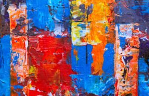 A colorful and dynamic abstract painting with rich textures and bold colors on canvas.